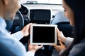 Couple Using Tablet With Empty Screen Sitting In Car, Back-View Royalty Free Stock Photo