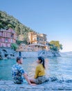 Couple on vacation ligurian coast Italy, Portofino famous village bay, Italy colorful village Ligurian coast