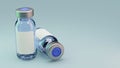 Couple of vaccine glass vials on cyan background