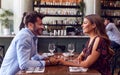 Couple On Valentines Day First Date Sitting At Table In Restaurant Royalty Free Stock Photo