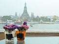 Couple Vases of Flower with Temple of Dawn in Background
