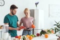 couple of vegans choosing vegetables for salad