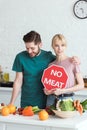 couple of vegans with no meat sign Royalty Free Stock Photo