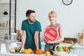 couple of vegans standing with no meat sign Royalty Free Stock Photo