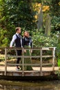 Couple in Victorian fashion near lake in park