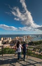 Couple in the viewpoint of Malaga . View of the port of Malaga, Spain and the city hall building at sunset