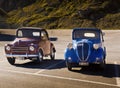 Couple of vintage cars in the parking lot of Sass Pordoi funicular, Italy