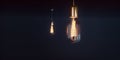 Couple vintage glowing light bulbs on dark background