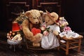 A couple of vintage style teddy bears sitting on sofa and celebrating Valentines Day Royalty Free Stock Photo