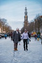 Ice skating on the canals in Amsterdam the Netherlands in winter, frozen canals in Amsterdam during winter Royalty Free Stock Photo