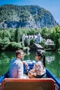 Couple visit Hallstatt village on Hallstatter lake in Austrian Alps Austria Royalty Free Stock Photo