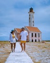 couple visit Island Klein Curacao in the Caribbean near the Island Curacao with the red lighthouse