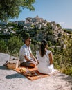 Couple visit the old town of Gordes Provence,Blooming purple lavender fields at Senanque monastery, Provence, southern Royalty Free Stock Photo