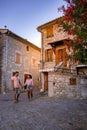 couple visit Ruoms, The medieval village of Ruoms with its old brick houses and small alleys on the Ardeche River in Royalty Free Stock Photo