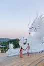 Couple visit Wat Huay Pla Kang Chiang Rai Thailand, Big Budha temple in Chiang Rai Royalty Free Stock Photo