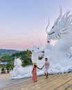 Couple visit Wat Huay Pla Kang Chiang Rai Thailand, Big Budha temple in Chiang Rai Royalty Free Stock Photo