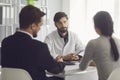 Couple visiting a doctor in a clinic office. Royalty Free Stock Photo