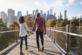 Couple Visiting New York With Manhattan Skyline In Background