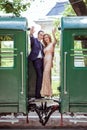 A couple between by wagons Royalty Free Stock Photo