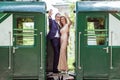 A couple between by wagons Royalty Free Stock Photo