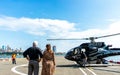 A couple waiting to get in Helicopter , Manhattan , New york city