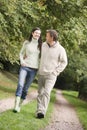 Couple on walk along woodland path Royalty Free Stock Photo