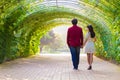 Couple walk in the green tunnel Royalty Free Stock Photo