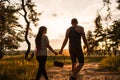 Couple walk informal meadow picnic love concept.