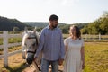 Couple walk at the ranch during summer day Royalty Free Stock Photo