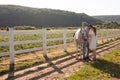 Couple walk at the ranch during summer day Royalty Free Stock Photo