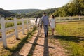 Couple walk at the ranch during summer day Royalty Free Stock Photo