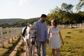 Couple walk at the ranch during summer day Royalty Free Stock Photo