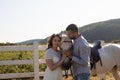 Couple walk at the ranch during summer day Royalty Free Stock Photo