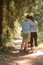 Couple walk in summer forest