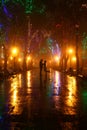 Couple walking at alley in night lights Royalty Free Stock Photo