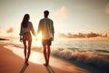 Couple walking along a beach on a romantic evening Royalty Free Stock Photo