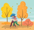 Couple Walking in Autumn Park with Falling Leaves Royalty Free Stock Photo