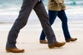 Couple Walking Away on the Beach Royalty Free Stock Photo