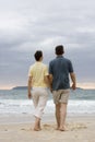 Couple walking on the beach Royalty Free Stock Photo