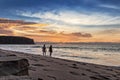 Couple walking on the beach of Cabo Ledo. Angola. Africa. Royalty Free Stock Photo