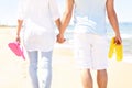 Couple walking at the beach and carrying flip flop Royalty Free Stock Photo