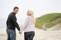 Couple walking at beach holding hands Royalty Free Stock Photo