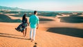 couple walking at the beach of Maspalomas Gran Canaria Spain, men and woman at the sand dunes desert Royalty Free Stock Photo