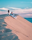 Couple walking at the beach of Maspalomas Gran Canaria Spain, men and woman at the sand dunes desert of Maspalomas Royalty Free Stock Photo