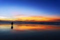 Couple walking on beach at sunset Royalty Free Stock Photo