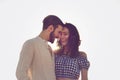 Couple walking on beach. Young happy interracial couple walking on beach smiling holding around each other. Royalty Free Stock Photo