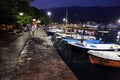 Couple walking in Budva coastline at night