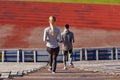 Couple walking downstairs on stadium Royalty Free Stock Photo