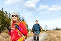 Couple walking and hiking on mountain trail Royalty Free Stock Photo