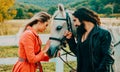 Couple walking with horse on coutriside. People are happy and having a good time. Couple man and woman walking on a Royalty Free Stock Photo